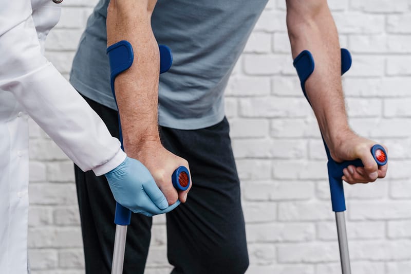 Professional therapist demonstrating rehabilitative movements to improve patient posture and functional strength.