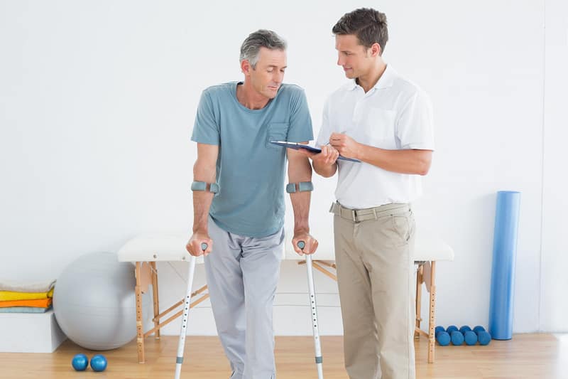 Clinician applying therapeutic pressure during a deep tissue sports massage to alleviate chronic muscle pain.